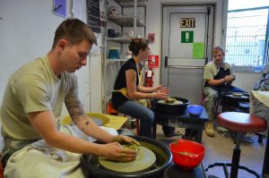 Soldiers exploring clay in the Resiliency through Art program at the Vicenza Art Center.